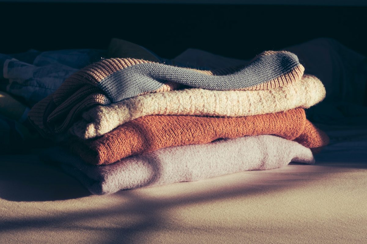 Neutral apparel fabrics and garments arranged for category planning.